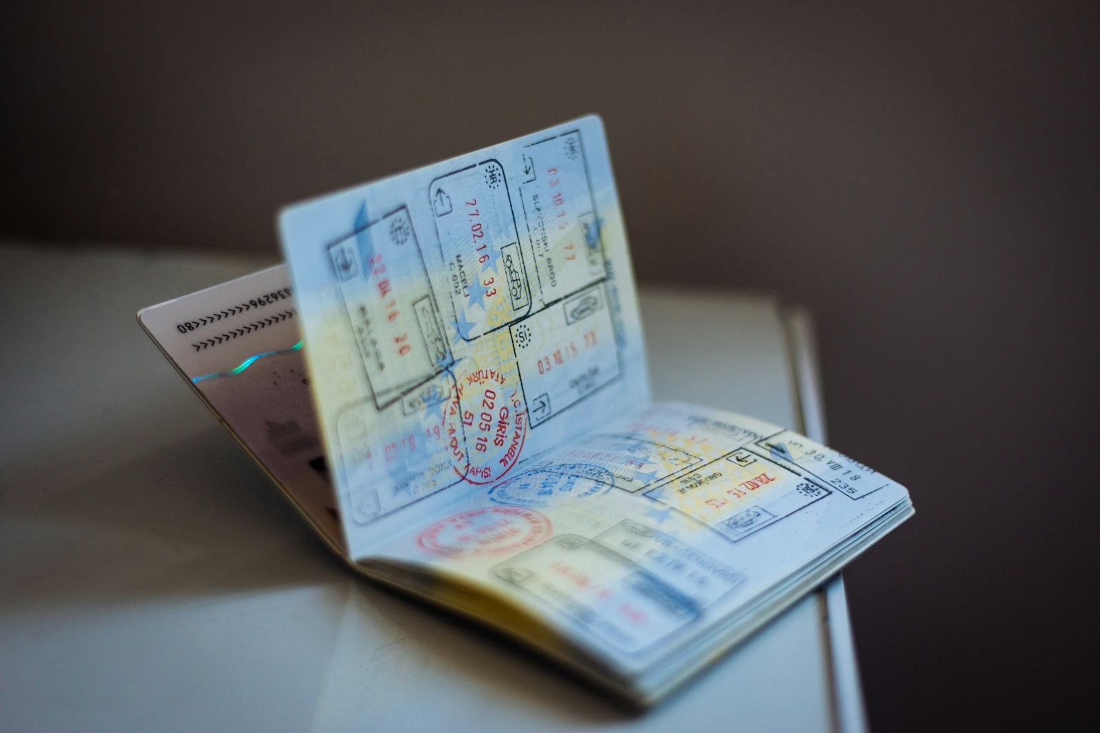 Open passport with visa stamps